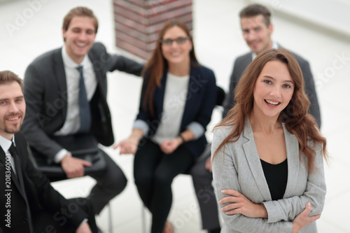 young woman at a business meeting with colleagues.