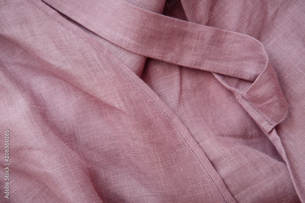 Fototapeta premium Blush pink soft linen fabric texture. Delicate sensual folds. Fashion designer textile concept