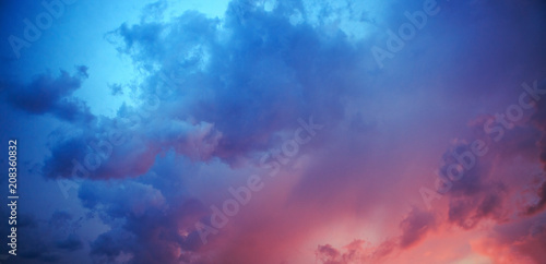 Red sky with blue clouds