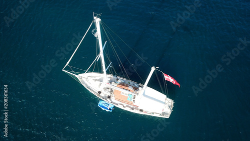 Aerial drone bird's eye view of luxury yacht docked in emerald colour clear waters © aerial-drone