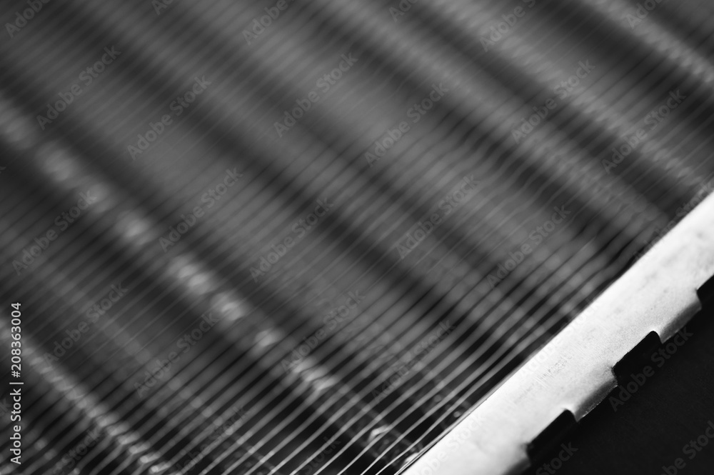 Part of the radiator for cooling the engine close-up. Steel texture. Part of the radiator for cooling the engine close-up. Steel texture.