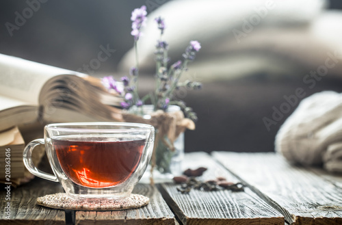 a cup of tea with a book in the interior