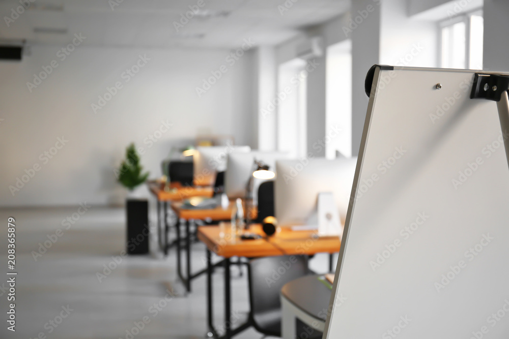 Office interior with tables, chairs and flip chart. Workplace design Office interior with tables, chairs and flip chart. Workplace design
