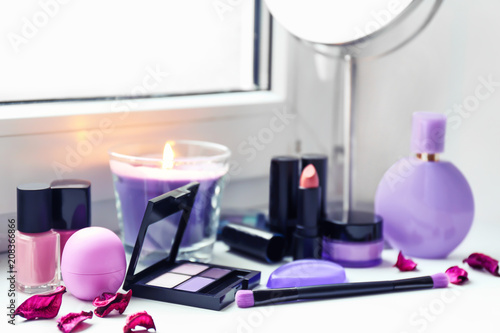 Set of decorative cosmetics on windowsill