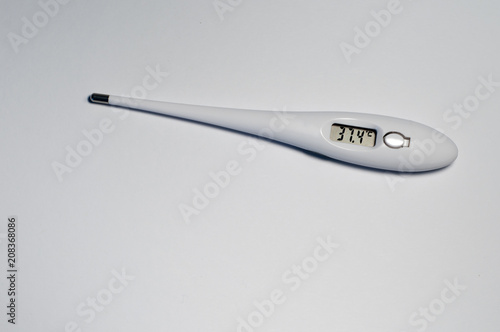 White thermometer with high temperature 37.4 photo