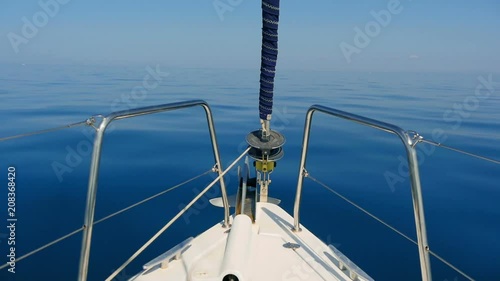 Bow of sailing boat cutting through calm blue Adriatic sea in slow motion hd. Filmed from moving sailing boat on sailing trip in Croatia in slow motion hd.