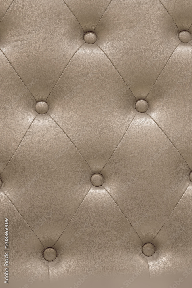 A padded leather cloth in a delicate shade of beige captivating with its meticulously crafted intricate texture carefully designed with quilting pattern which adds a touch of luxury and refinement.