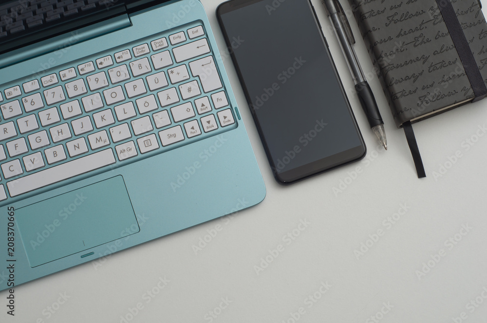 the computer on a desktop with the notebook and the handle the computer on a desktop with the notebook and the handle
