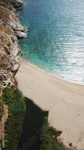 Aerial drone bird's eye view photo of iconic beach of Potami or River with turquoise clear waters, South Evia island, Greece