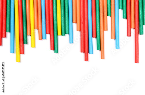 Colorful decorative sticks isolated on white background, top view