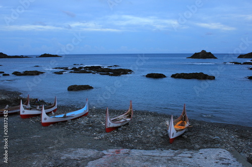 Aboriginal Canoe with Beautiful Feather Decoration on the Beach of Lanyu During Flying Fish Festival at Taitung, Taiwan photo