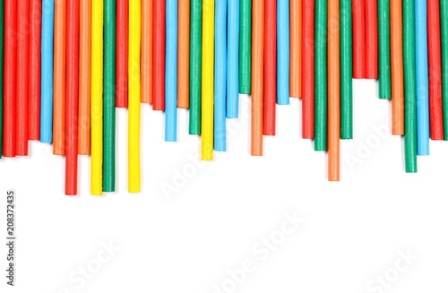 Colorful decorative sticks isolated on white background  top view