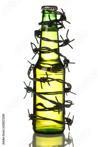 Wallpaper Mural Green beer bottle wrapped in barbwire on white isolated background. Stop alcoholism. Drink responsibly. Drink aware, Torontodigital.ca
