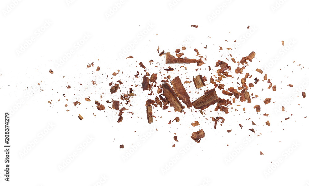Cinnamon shavings isolated on white background, top view