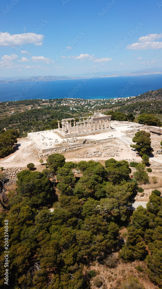 Aerial drone bird's eye photo of iconic Temple of Aphaia with views of Agia Marina and Saronic Gulf, island of Aigina, Greece