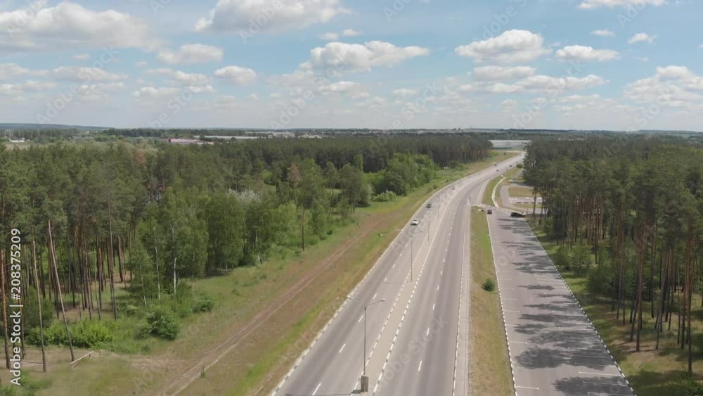 aerial photography. flight over the forest, parking and highway. aerial photography. flight over the forest, parking and highway.