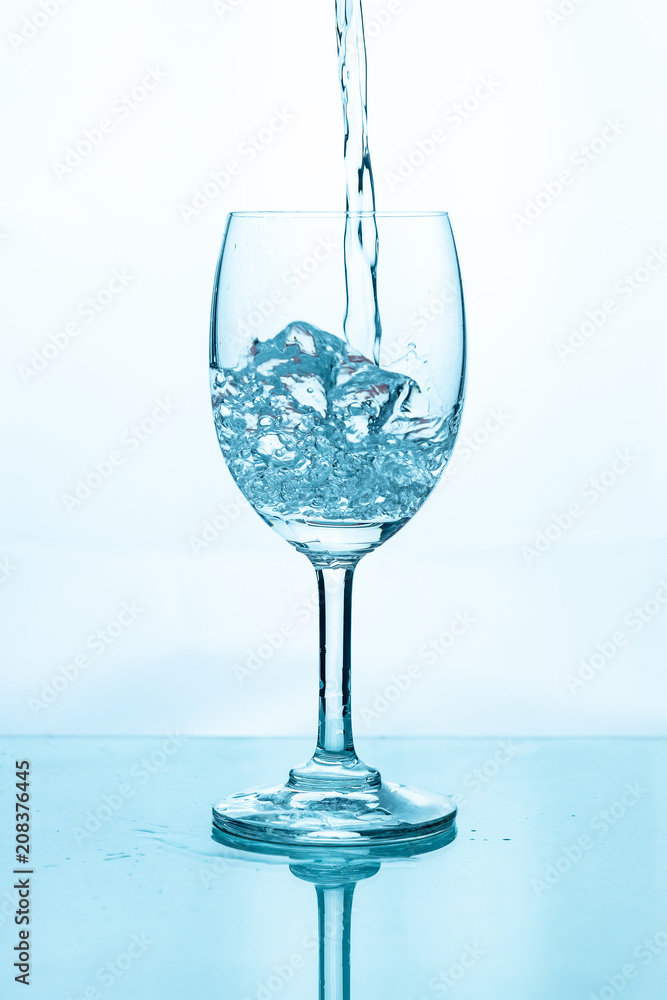 Water splashing into a glass