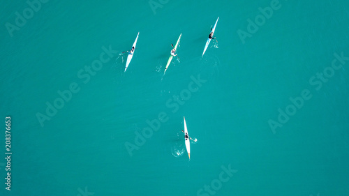 Aerial drone bird's eye view of sport canoe in turquoise clear waters
