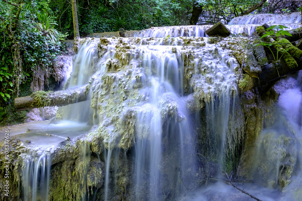 Obraz premium Multilevel waterfall on a rocky terrain 2