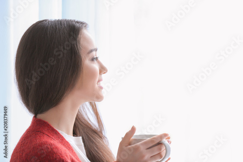 Beautiful young woman with ...