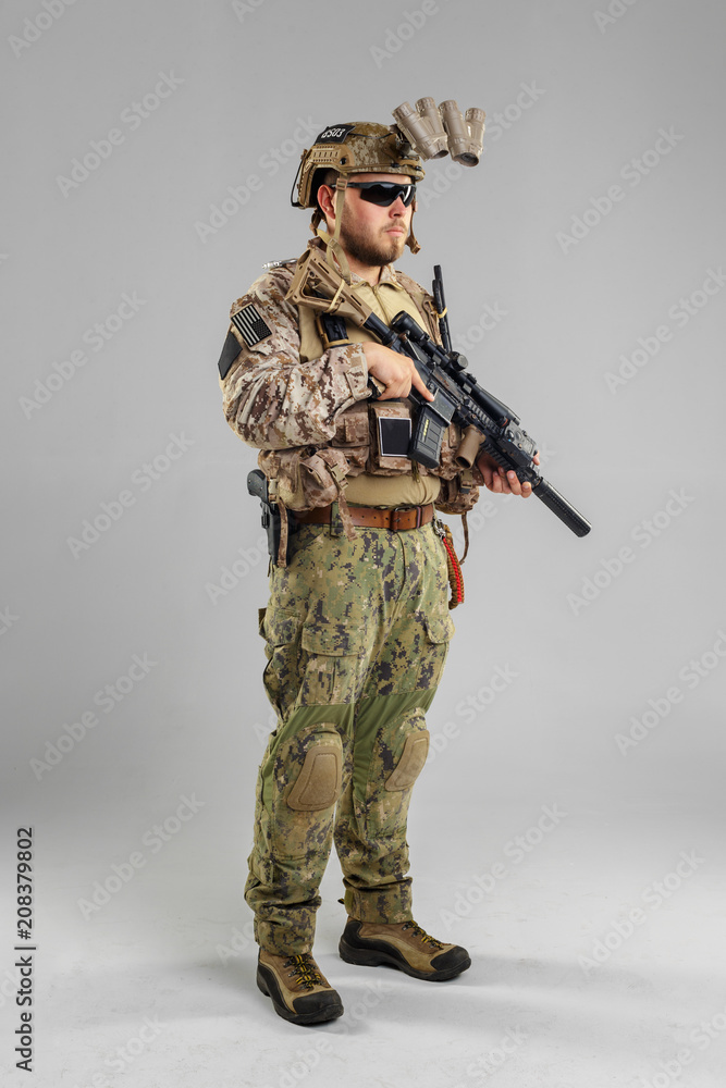 Special forces soldier with rifle on white background. Special forces soldier with rifle on white background.