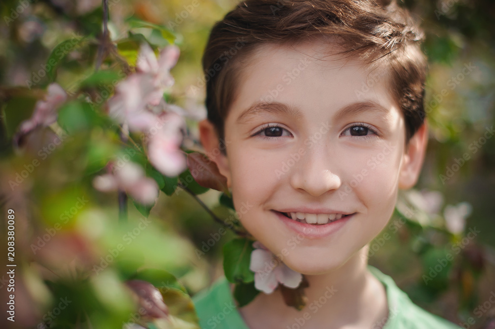 Portrait of a beautiful boy in a spring park. Portrait of a beautiful boy in a spring park.