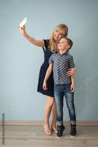 Young woman taking selfie w...