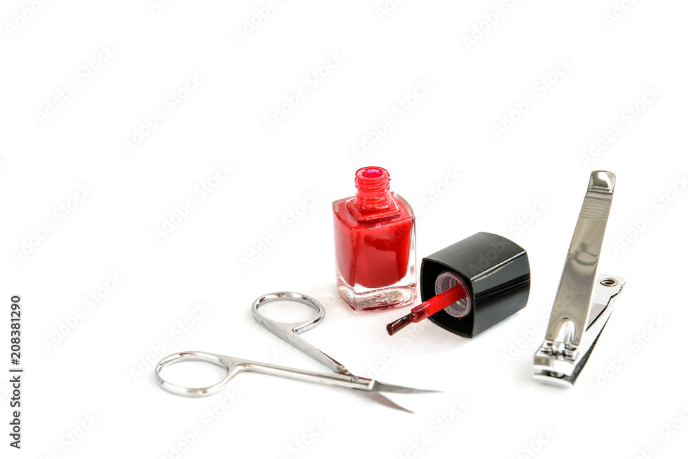 Manicure scissors, forceps and red nail varnish isolated on white background. Manicure scissors, forceps and red nail varnish isolated on white background.