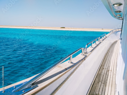 Amazing view on the tropical Island with white sand from the side of the yacht. Travel and Vacation concept © dxoroshun