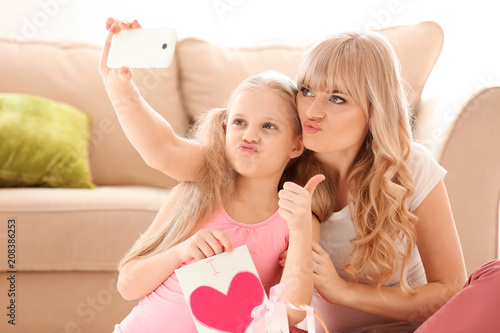 Cute little girl and her mo...