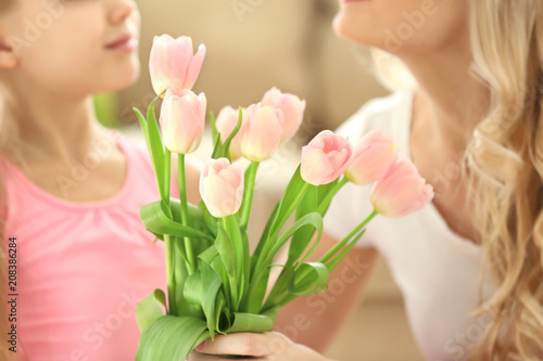 Cute little girl giving tul...