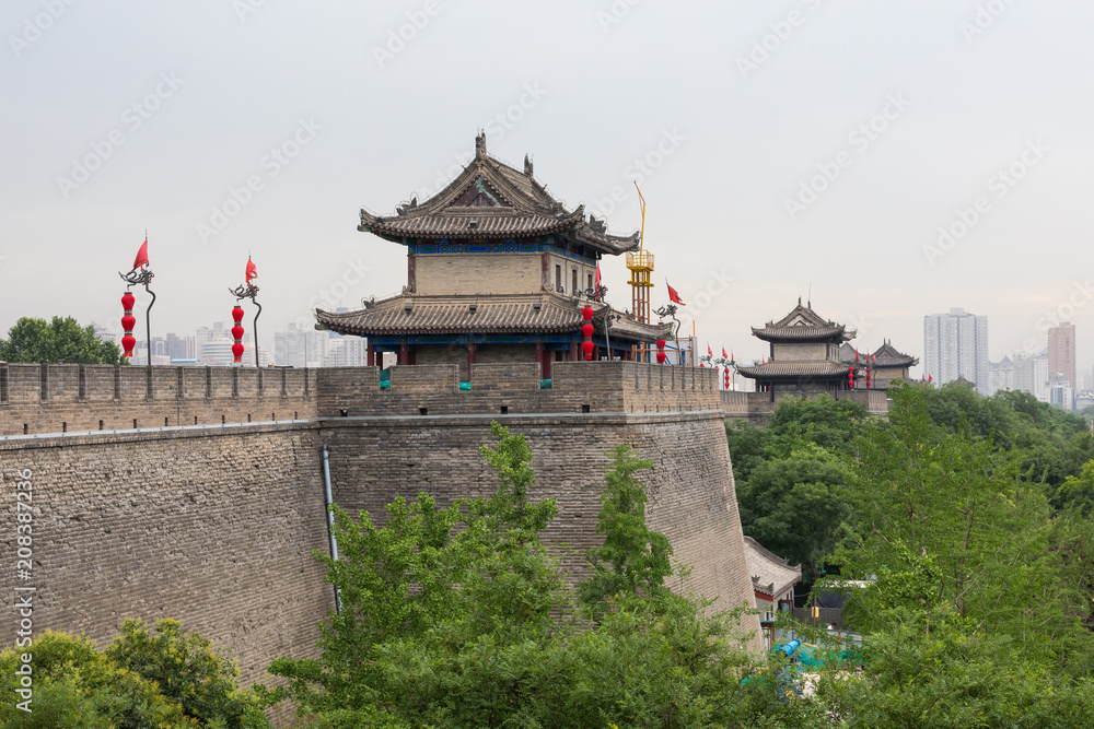 Tourists walk on the South Gate of Xian City Wall ,one of the oldest and best preserved Chinese city walls April 16, 2010 in Xian of Shaanxi Province, China. Tourists walk on the South Gate of Xian City Wall ,one of the oldest and best preserved Chinese city walls April 16, 2010 in Xian of Shaanxi Province, China.