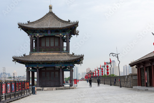 Tourists walk on the South Gate of Xian City Wall ,one of the oldest and best preserved Chinese city walls April 16, 2010 in Xian of Shaanxi Province, China. photo