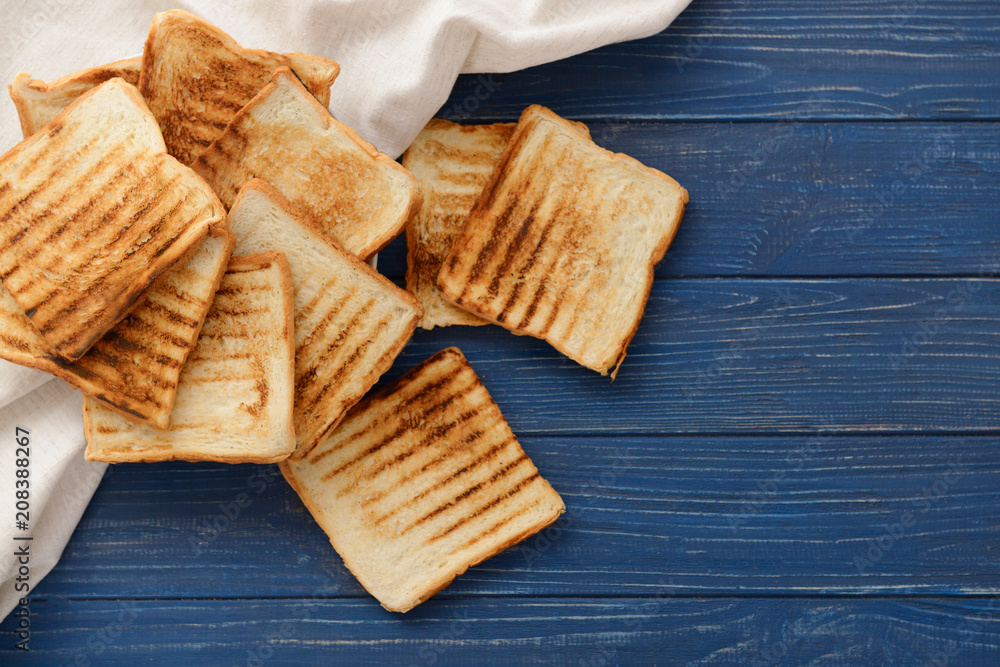 Tasty toasted bread on wooden background, top view Tasty toasted bread on wooden background, top view