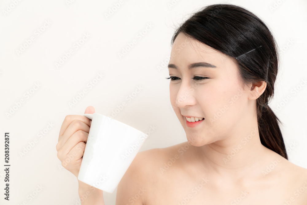 Asian beauty young woman close up head on face with white and healthy bright skin in motion use cometics treatment isolated on white background , included copyspace for advertise your product Asian beauty young woman close up head on face with white and healthy bright skin in motion use cometics treatment isolated on white background , included copyspace for advertise your product