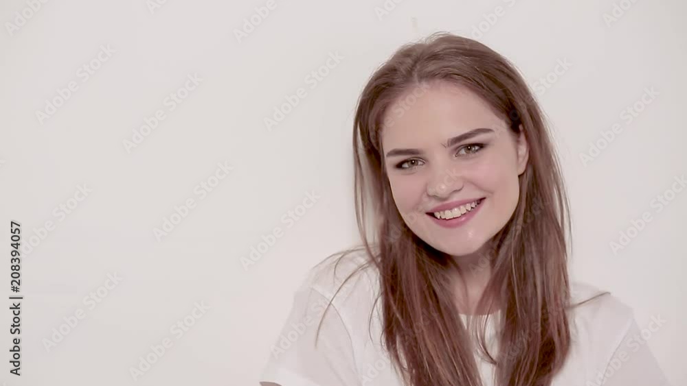 Happy smilimg young woman with luxury hair and natural makeup. Fashion concept. Happy smilimg young woman with luxury hair and natural makeup. Fashion concept.