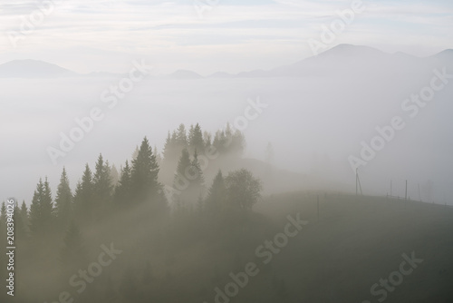 Autumn landscape with fog in the mountains