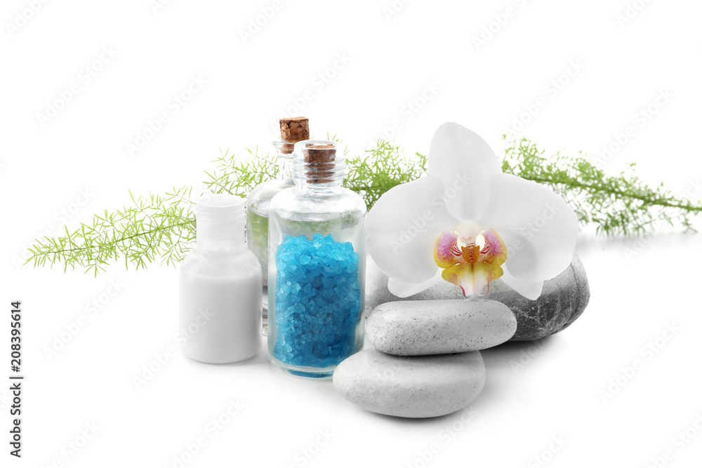 Beautiful spa composition with bottle of sea salt and stones on white background Beautiful spa composition with bottle of sea salt and stones on white background