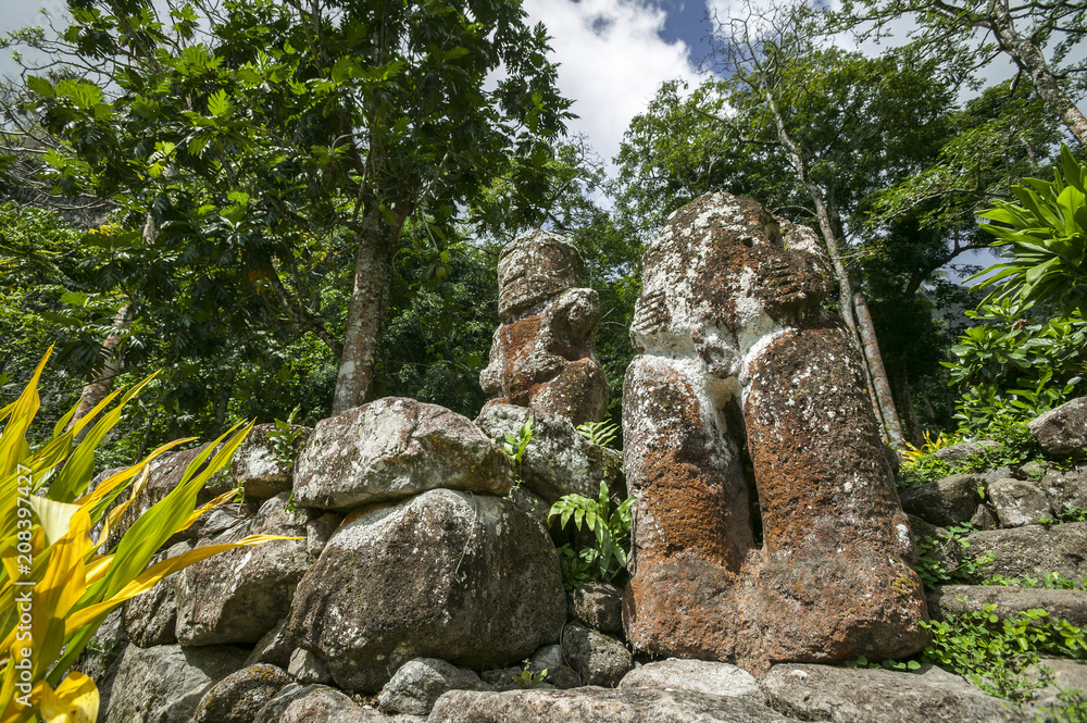 historic stone statues, so called Tikis, created by native inhabitants of Hiva Oa, Marquesas Islands, French Polynesia historic stone statues, so called Tikis, created by native inhabitants of Hiva Oa, Marquesas Islands, French Polynesia
