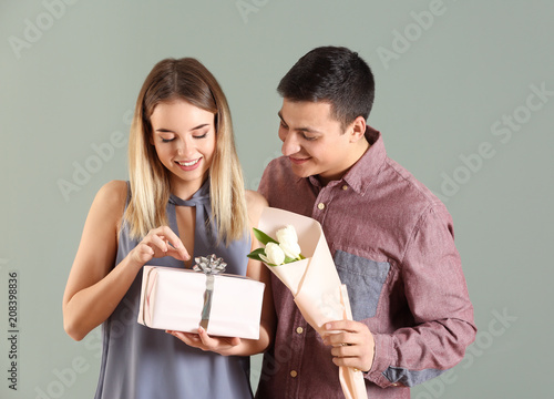 Young man giving present an...