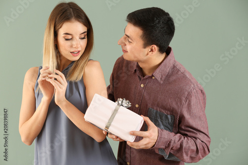 Young Man Presenting Gift t...