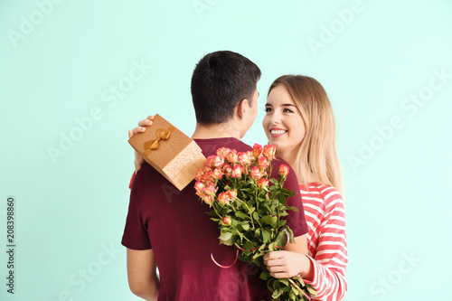Happy young woman with gift...