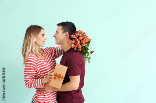 Happy young woman with gift...