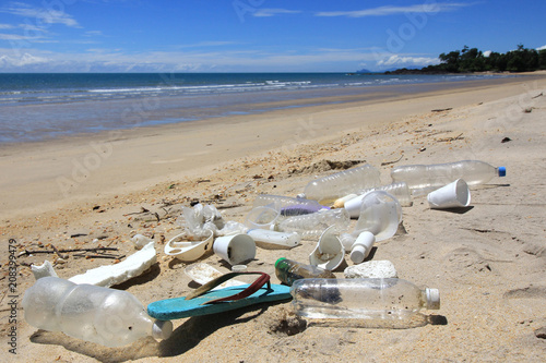 Plastic pollution on beach. Plastic bottles, bags and other garbage washes up in beach