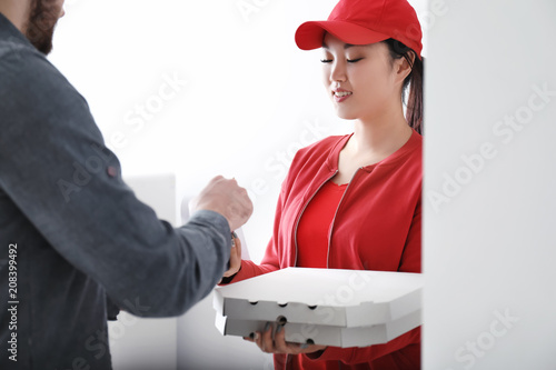 Young man receiving order f...