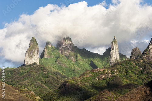 approaching Ua Pou Island from sea, Marquesas Archipelago, French Polynesia, spectacular landscape with extremely steep mountains