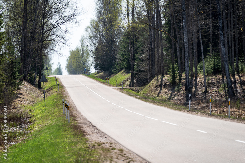 Fototapeta premium empty gravel road in the countryside in summer heat