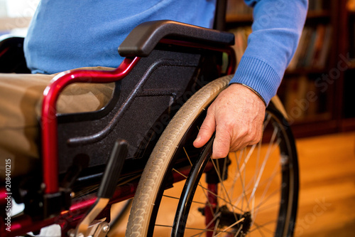 Senior mature man at wheelchair close up