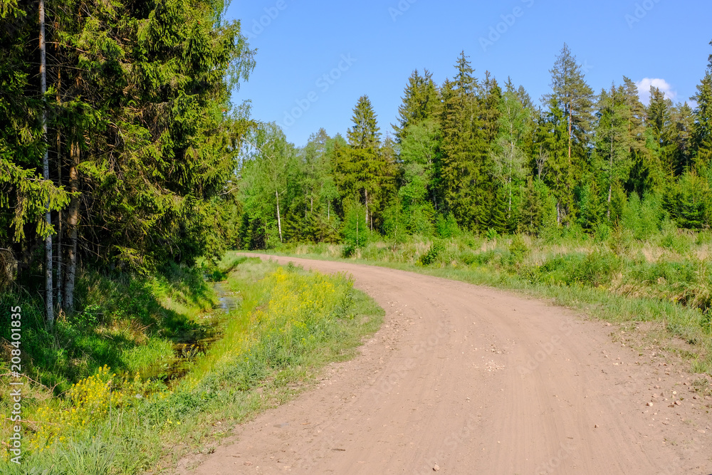 empty gravel road in the countryside in summer heat empty gravel road in the countryside in summer heat