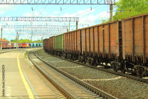 Freight railroad cars at the station. The train on the rails. Close-up.